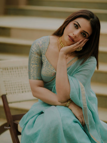 SIRI KAVYA : Sky Blue Linen Tissue Saree with Gold Zari Border